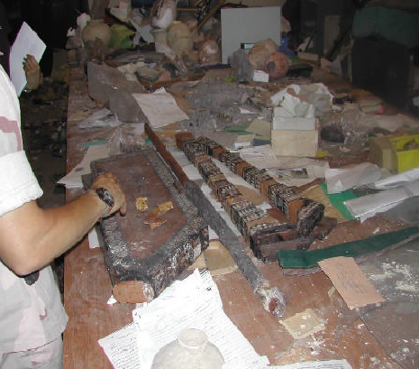 The lyre’s reconstructed wooden body was found damaged in the museum’s restoration and registration room.  (Source: Col. Bogdano’s briefing)